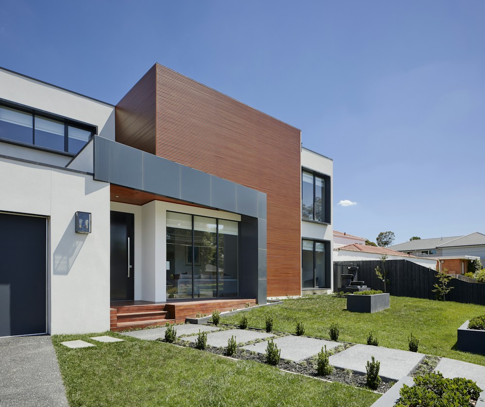 Modern home exterior with a landscaped entrance