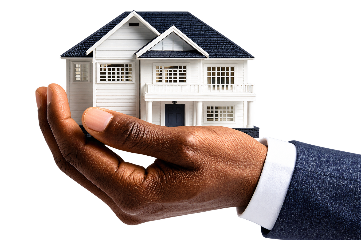 A hand holding a miniature white home